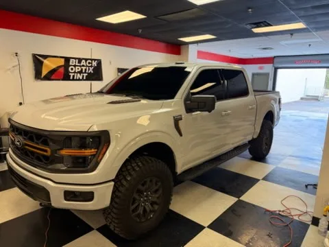White Ford F-150 Tremor with ceramic tint at Black Optix Tint Pensacola