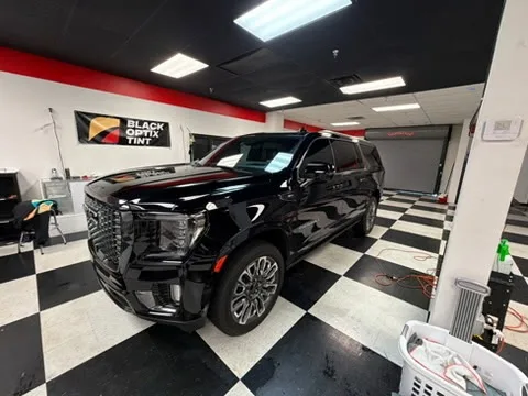 Black GMC Yukon Denali tinted at the Pensacola shop